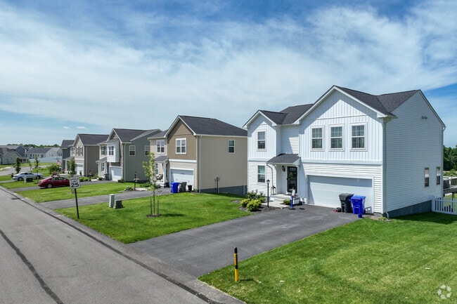 Some houses in Connoquenessing have an attached garage with a wide driveway.