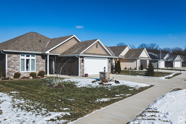 Ranch homes line the sunny streets of Cambridge Oaks.