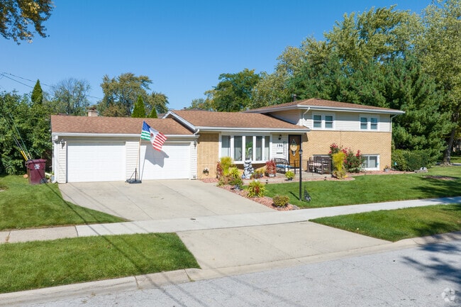 Many front lawns have decorative spruces in North End.
