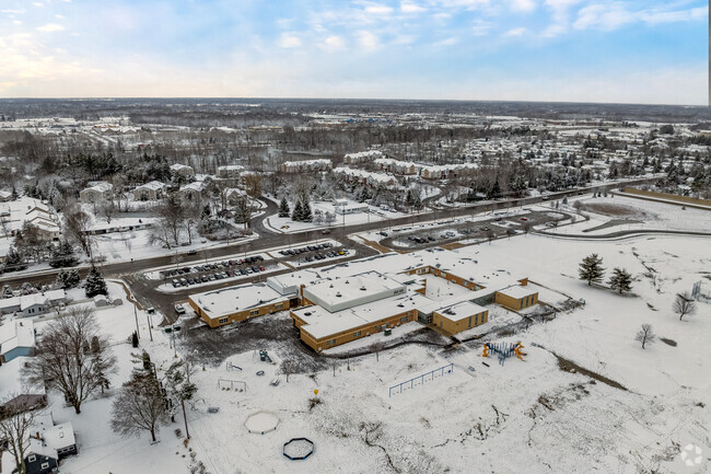 The playground and rear of Delta Center Elementary School.