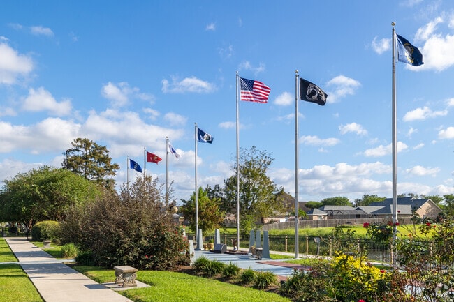 Residents hold a remembrance at Memorial Park near Ouiski Bayou Estates.