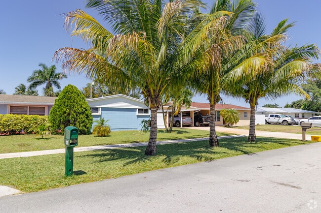 Palm trees shade the pastel colored homes in the picturesque Berkshire neighborhood.