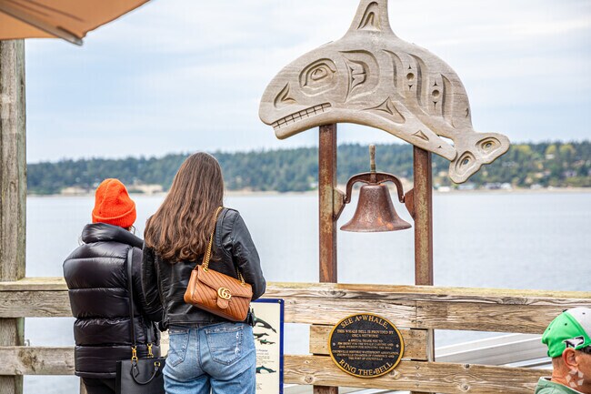 Visitors enjoy panoramic bay views from Coupeville Wharf near Penn Cove Park’s shoreline.