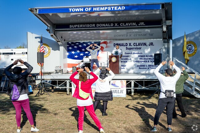 The Run, Walk, Praise 5K starts with a pre-race warmup led by Mr. Chris.
