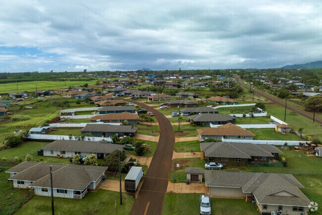 Single family ranch homes line dirt roads in Anahola.