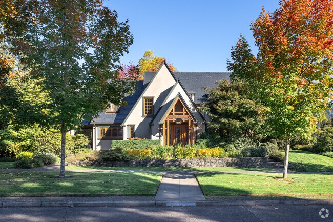 The Fall season adds a splash of orange to the landscaping of a home in South University.