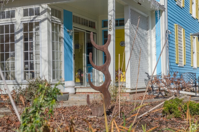 Yard art in Conway graces the front of a property in the form of semicircular stacks.