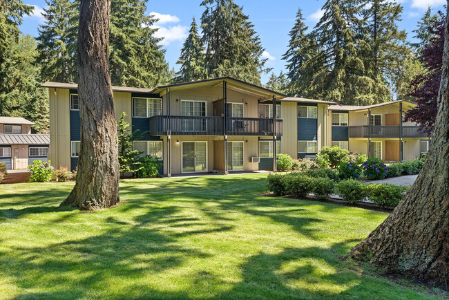 Experience serene living with this spacious, light-filled apartment set amidst picturesque forest views.