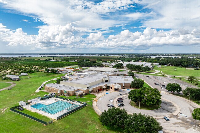 Lake Placid High School has a central drop off area and outdoor swimming pool.
