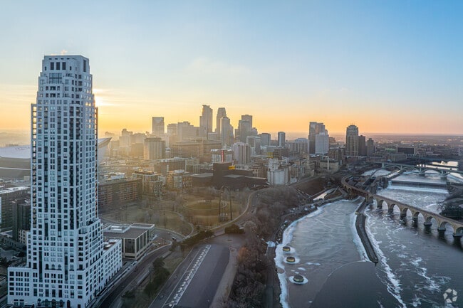 An evening view of Downtown East with Eleven on the River in the foreground.