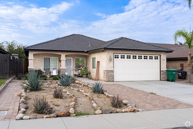 This Spanish style inspired home in Meadow View has drought-resistant landscaping.