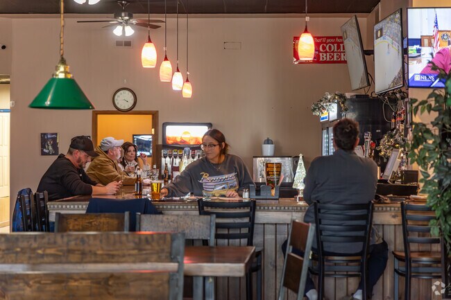 Brighton Township locals stop in Tusca’s Pizzeria for a drink and to watch a sports game.