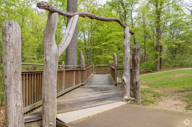A wood walkway leads to the Mount Airy Forest treehouse near East Westwood.