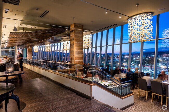 Vintana Wine & Dine Restaurant Interior at Twilight Full of Guests