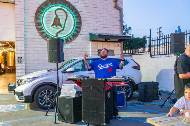 The DJ calls out to a customer at the San Fernando Brewing Co in San Fernando.