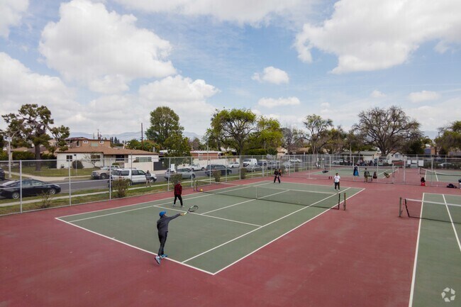 Play with your friends at Panorama Recreation Center Tennis Court.