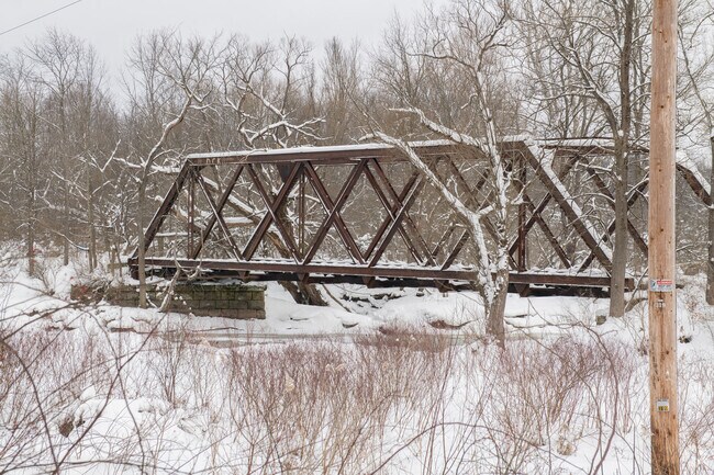The Marden E. Cobb Waterway Trail near Frewsburg offers scenic hiking routes and historic Whipple-truss bridge views.