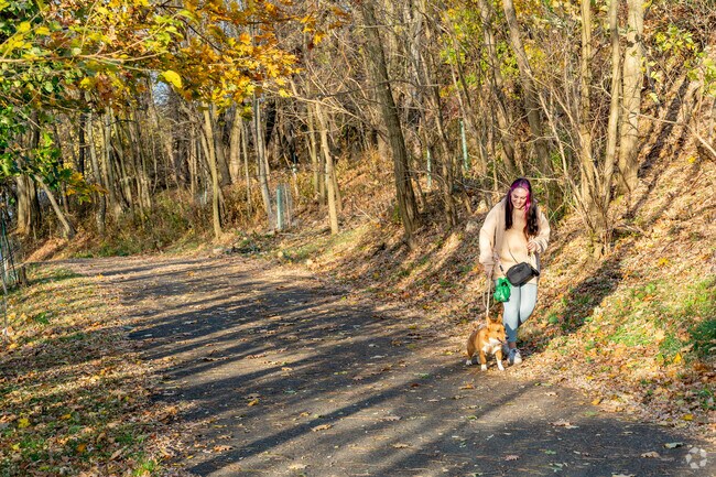 Residents walk the Julia Connector Trailhead in South Side Park.