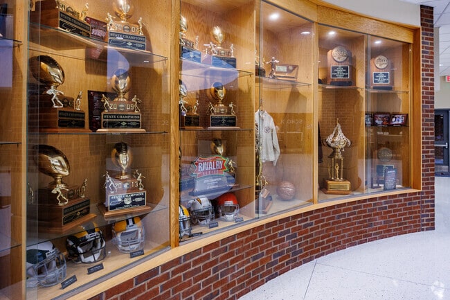 Students stop by to admire the trophy case of state championships at Alcoa High School in Alcoa.