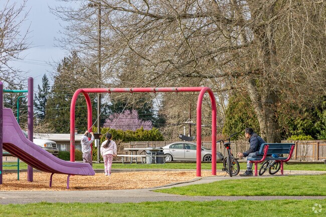 Kids love to play on the swing set at Highlands Park.