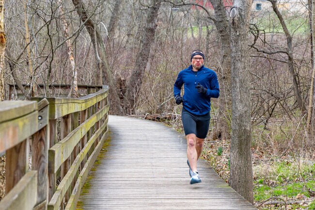 A Swisshelm Park residents cuts through Frick Park on Nine Mile Run Trail.