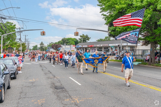 The Knights of Columbus leading a section of the parade down Broadway in Massapequa.