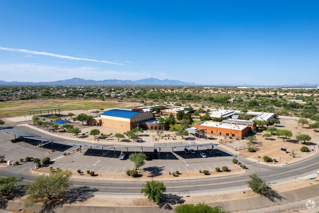 An aerial view of Desert Sky Middle School with lots of parking spaces.