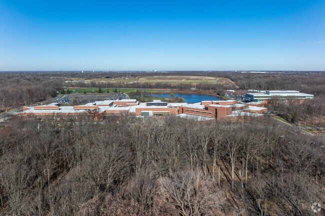 Oakton Community College is located in Des Plaines adjacent to a forested area.