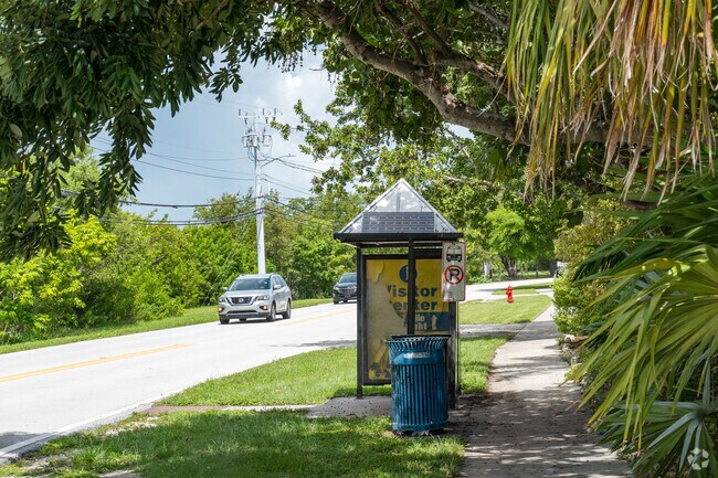 Monroe County public transit system offers bus stops with covered seating areas.