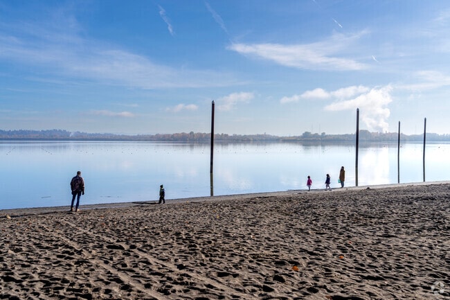 Kids play on sandy beaches at Vancouver Lake Park near Knapp, Vancouver.