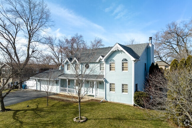 Located in Addison, Craftsman style home has a light blue siding.