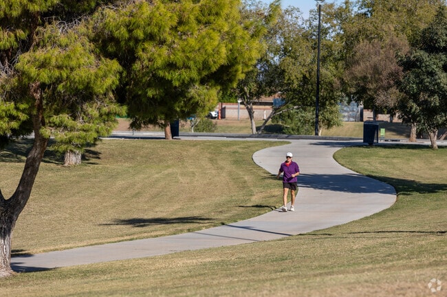 Greenfield Park has lengthy walking paths with large shade trees.