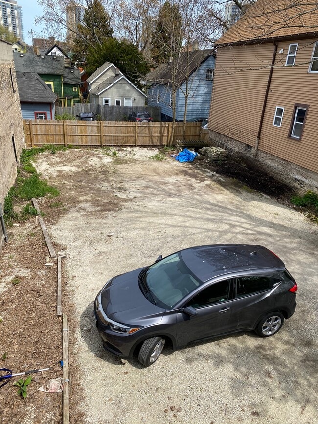 Rear fenced parking area