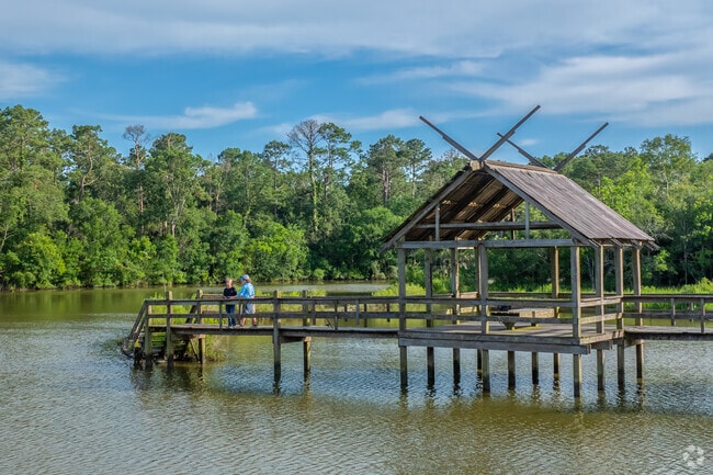 Residents of Dickinson are seen fishing off the pier located at Paul Hopkins Park.