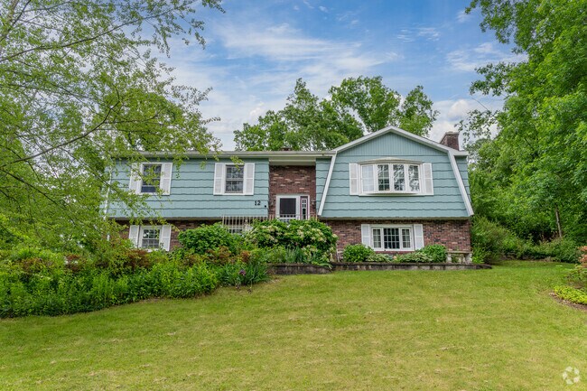 This beautiful home stands on a raised lot in Quinnipiac Meadows.
