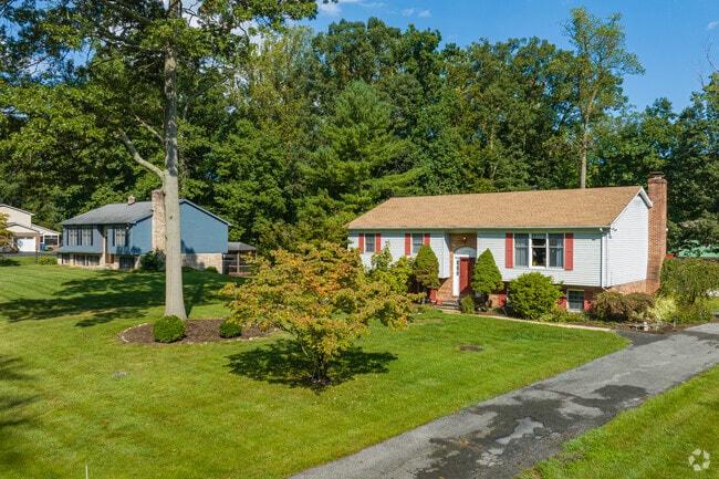Large split level homes typically have sizable yards and attached driveways in Kirkwood.