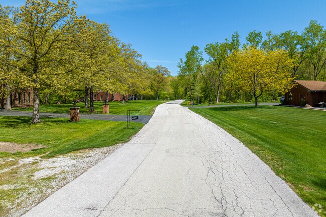Homes in Faithorn have large, well-manicured lawns and nearby woods.