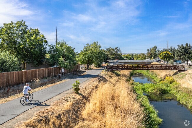 A cyclist enjoys the fresh air and scenic views while riding along Marsh Creek Trail.