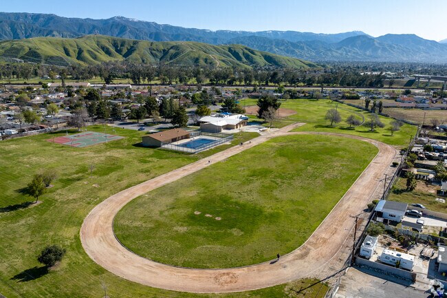 People walking on the track in Delman Heights Park.