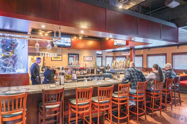 The bar at Coastal Grille is a meeting place for the community of Spring Ridge.