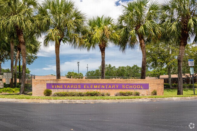 Vineyards Elementary School in Naples welcomes students with a large entry sign.