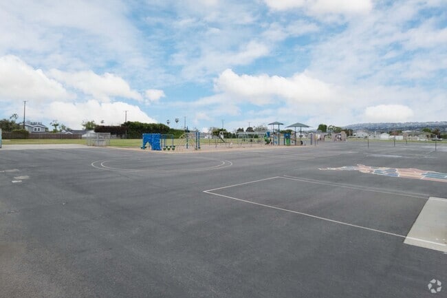 Anza Elementary School offers a blacktop and playground for student recreation in Southwood.
