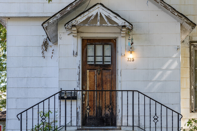 A wooden door with artistic overhang points to the history of Byers and Murphy.