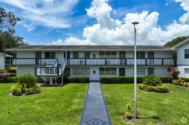 Two story condo building in Century Village residential community in West Deerfield Beach.
