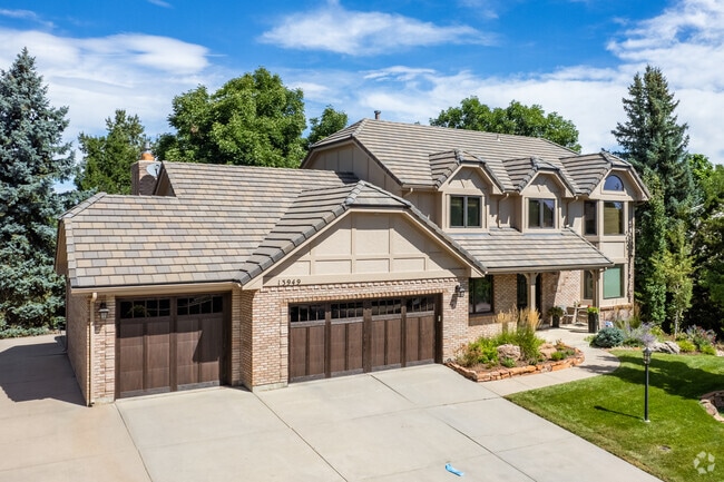 Contemporary tudor-revival homes sit on lakeside lots in Candlelight.