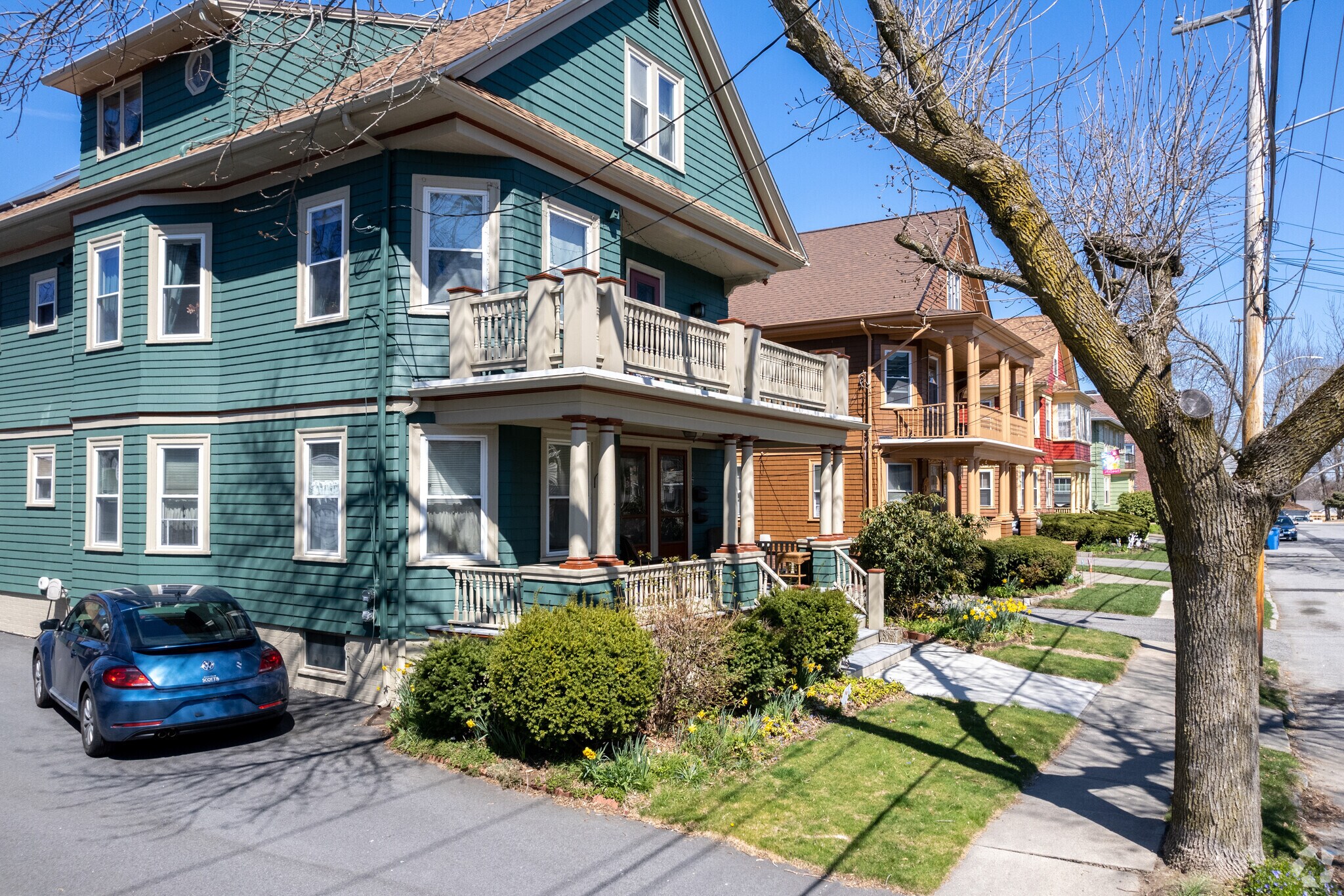 Victorian homes with off-street parking and shady trees line the streets in Park View