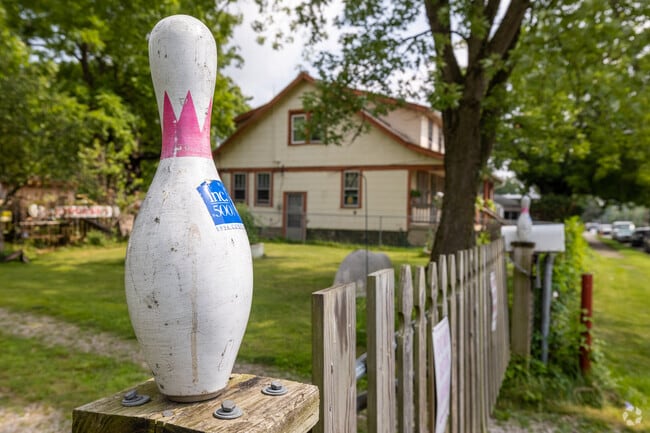 A quirky bowling pin adorns the fence of this home in Devon Triangle.