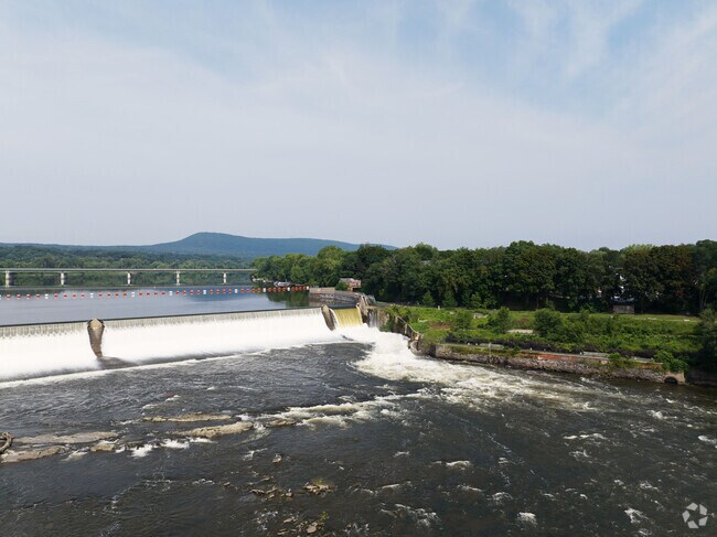 A beautiful view of the Connecticut River and dam passing by South Hadley.