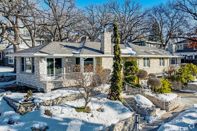 Rambler white brick home in Lowry Hill.