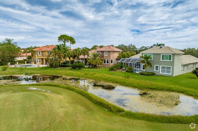 Enjoy a cup of coffee while watching golfers tee off from your Bayou Club backyard.